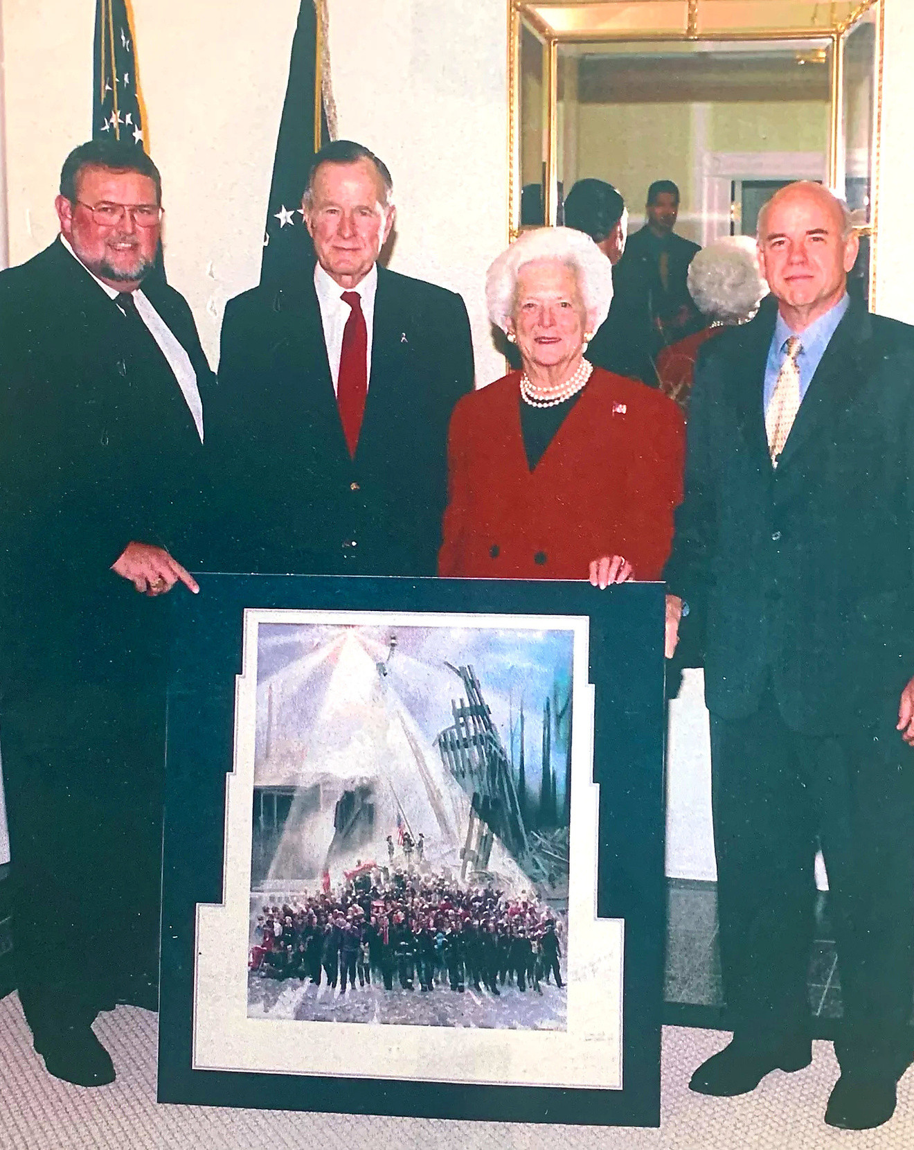 Kenneth R. Turner, at right, with President George H. W. Bush and Barbara Bush at the signing of the Out of the Ashes edition, 2002
